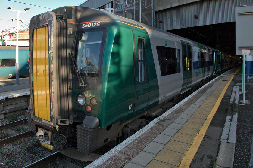 350126, LN 14.24 London Euston-Northampton (2N69, 3E), London Euston station 
 As our train home was a three-set train led by 350126 and it was leaving from the shorter Euston's platform eight so getting a photograph of the front of the train was tricky as illustrated here. I am leaning against the barrier at the top of the platform ramp, leaning right back and have the lens on its widest angle setting! Due to various lens distortions at this extreme considerable work within Photoshop has been needed to get things looking sensible! My wife and I ravelled on the 14.24 from London back to Northampton. 
 Keywords: 350126 14.24 London Euston-Northampton 2N69 London Euston station London Northwestern Desiro