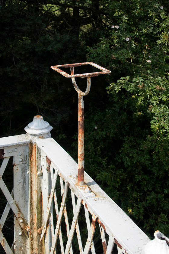 Former gas lamp holder, Springfield station 
 The wrought iron footbridge at Springfield was not in fantastic condition and was in much need of the attendance from a maintenance team. However, it did have these former oil lamp holders at each end and I hope that they are not removed when maintenance eventually takes place. 
 Keywords: Former gas lamp holder Springfield station