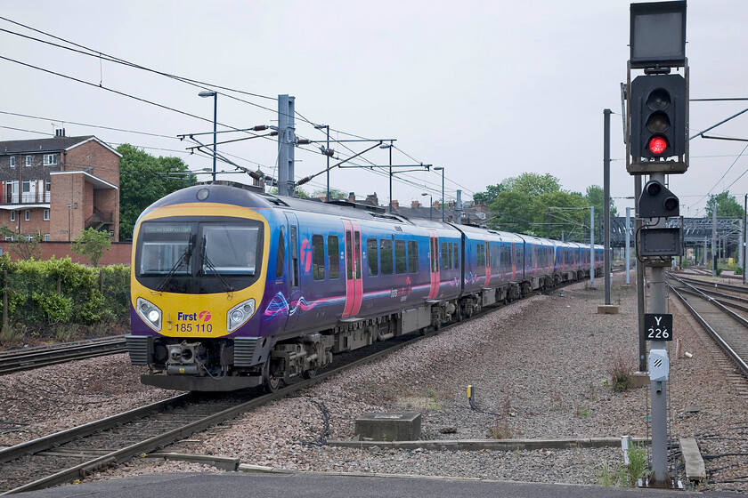 185110, TP 07.15 Liverpool Lime Street-Scarborough (1E81), York station 
 185110 and another unidentified unit arrive at York station from the west working the 07.15 Liverpool to Scarborough TPE train. This service has taken longer to get to York than, for example, the last few services that I photographed such as those from King's Cross and Edinburgh. Even though it's distance is a lot less at just under one hundred miles I suppose the number of stops and the winding route through the Pennines contributes to its much lower average speed. 
 Keywords: 185110 07.15 Liverpool Lime Street-Scarborough 1E81 York station TransPennine Express