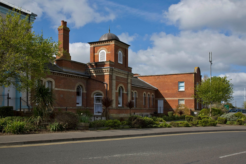 Frontage, Walton-on-the-Naze station (now housing) 
 Walton-on-the Naze station was opened 17.05.1867 by the Tendring Hundred Railway that was then absorbed and worked by the Great Eastern Railway (GER). The rather grand station building was once served by three platforms with it also having a small yard, locomotive shed and signal box. The station is now a single platform affair with a 1980s ticket office and a car park occupying the site of the former yard. The original station building seen here has now been turned into flats. 
 Keywords: Frontage Walton-on-the-Naze station