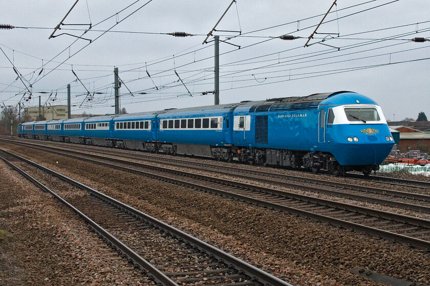 M43047, outward leg of the West Highland Pullman, 07.19 Finsbury Park-Fort William (1Z37, 5E), Sandy TL176510 
 I believe that the ECML never had any scheduled Pullman workings but I stand to be corrected! Going some way to address this matter LSLs outward leg of the West Highland Pullman three-day charter passes New Zealand bridge just north of Sandy with the former HST doing a very reasonable job of looking like a proper Pullman set! Passengers left Finsbury Park at 07.19 with pick-ups further north and arrival in Fort William in the early evening. In this formation M43047 is the leading power car that in its last life was in operation for EMT on the MML, see. https://www.ontheupfast.com/p/21936chg/28462366004/x43047-05-30-sheffield-london-st 
 Keywords: M43047 The West Highland Pullman 07.19 Finsbury Park-Fort William 1Z37 Sandy TL176510 HST