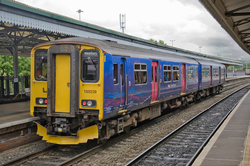 150239, GW 17.11 Westbury-Warminster (2F96), Westbury station 
 About to make a super short journey (4m 53ch to be precise) simply as a connecting and positioning move, 150239 is about to leave Westbury with the 17.11 to Warminster. It's the first day of June but notice the dark black and rain-laden clouds on the skyline! 
 Keywords: 150239 17.11 Westbury-Warminster 2F96 Westbury station First Great Western Sprinter