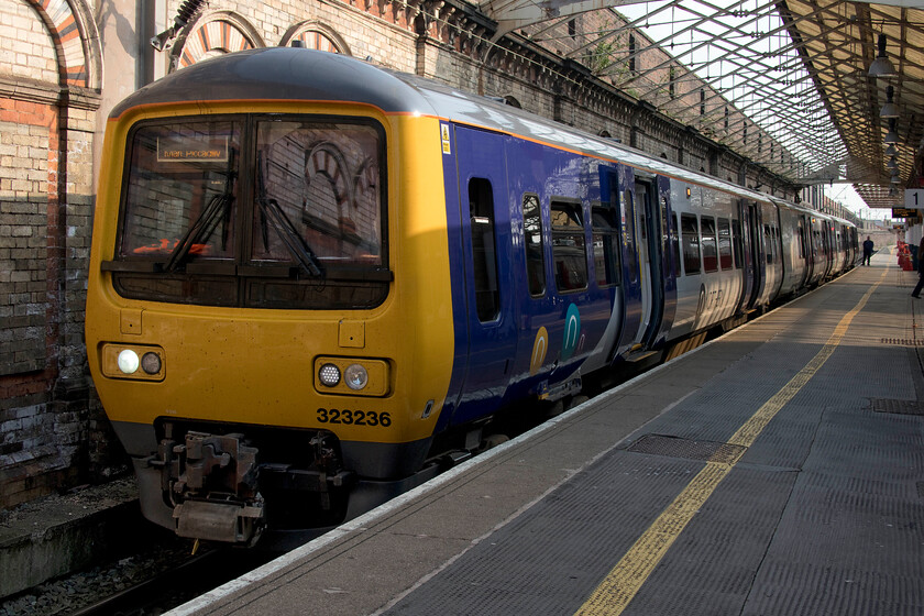 323236, NT 14.48 Crewe-Manchester Piccadilly (2H49, 1E), Crewe station 
 In an all too common (even today) pattern when the Class 323s entered service in the early 1990s they were beset with issues with it taking some years before their problems were overcome with them now being extremely reliable. They have recently undergone a complete overhaul to make them disability compliant and have a few years ahead of them yet. 323236 waits to leave Crewe station with the 2H49 14.48 service to Manchester Piccadilly. 
 Keywords: 323236 14.48 Crewe-Manchester Piccadilly 2H49 Crewe station Northern