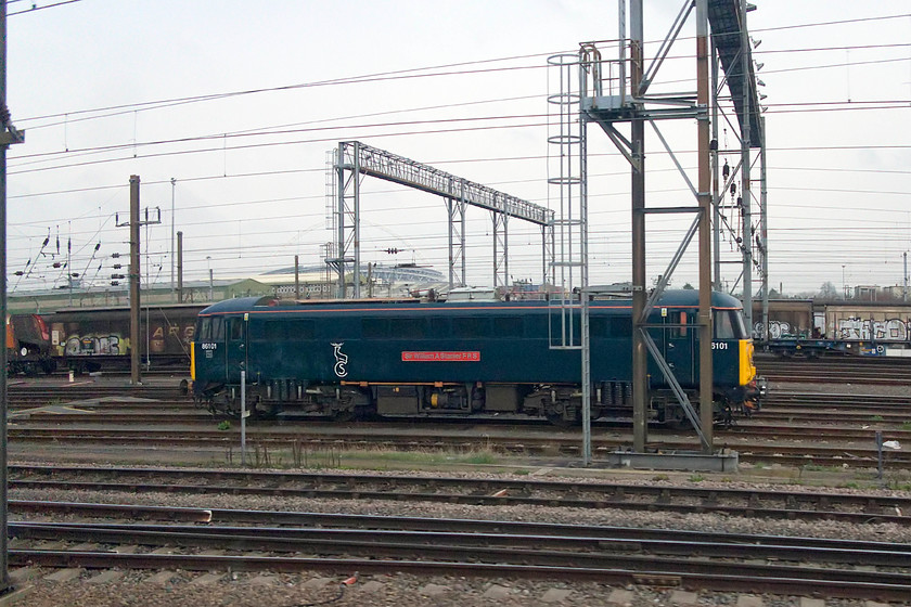 86101, stabled, Wembley Yard 
 Looking very smart in its Caledonian Sleeper livery 86101 'Sir William A Stanier FRS' stands in Wembley Yard. Apart from occasional sorties up the WCML this superb locomotive is restricted to moving the ECS for the sleeper in and out of Euston from Wembley where it is stabled. 
 Keywords: 86101 Wembley Yard