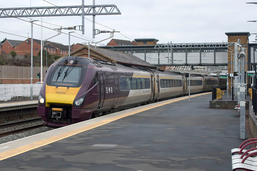 222020, EM 10.37 Sheffield-London St. Pancras (1C38, RT), Wellingborough station 
 222020 passes through Wellingborough station working the 10.37 Sheffield to St. Pancras EMR service. These Meridians have been in squadron service on the Midland route for a number of years and have proved to be reliable if not a little dull! They are set to be replaced with new build bi-mode units with the completion of electrification on the Market Harborough 'spur' that is now running very late. Indeed, the Tory Transport Secretary Grant Shapps made a misleading statement during a visit to Leicester on the day I took this photograph, see...... https://www.bbc.co.uk/news/uk-england-leicestershire-59729033 It was politically spun because the preparation for the electrification has been underway for many months now with spades already in the ground but it was made prior to an extended closure of the line over the coming festive break in order to undertake more extensive work. 
 Keywords: 222020 10.37 Sheffield-London St. Pancras 1C38 Wellingborough station EMR East Midlands Railway Meridian