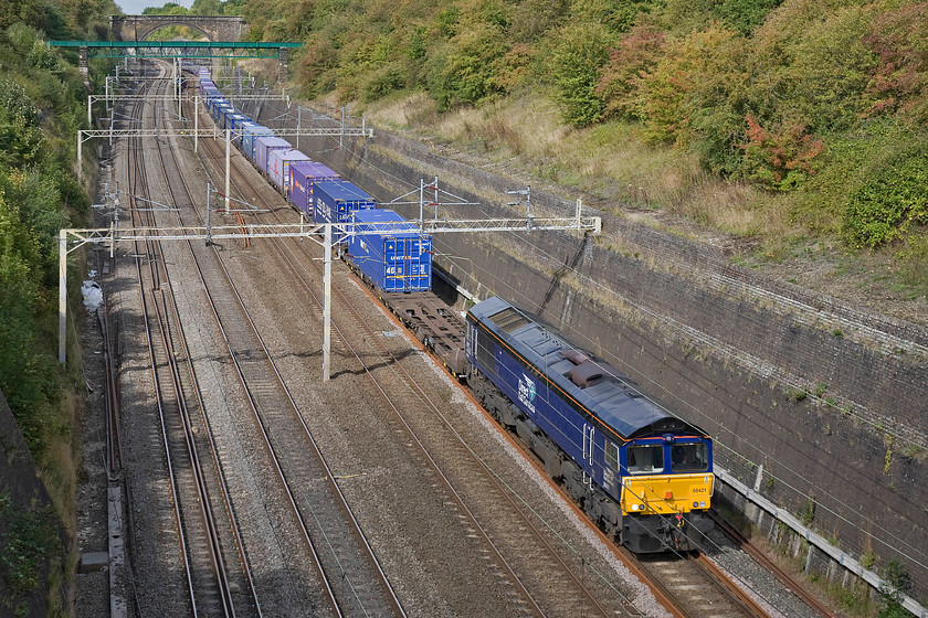 66421, 13.09 DIRFT-Purfleet (4L48), Roade cutting 
 DRS' 66421 leads the Sunday 13.09 Daventry to Purfleet Freightliner service. This 4L48 is a reliable service that is usually on-time a certainty for a lunchtime walk around the village of Roade where this photgraph is taken above the cutting. 
 Keywords: 66421 13.09 DIRFT-Purfleet 4L48 Roade cutting DRS Direct Rail Services