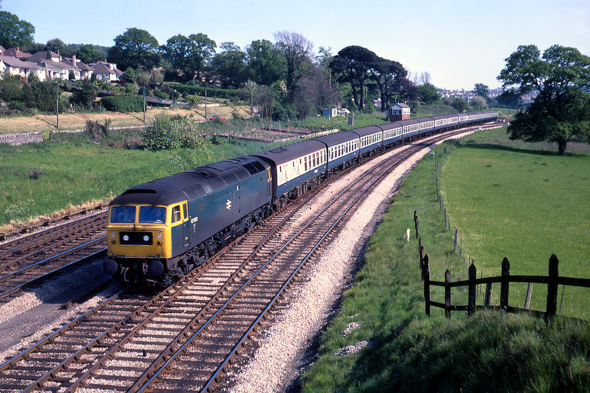 47090, 16.20 Paignton-London Paddington, Aller Junction 
 Having seen 47090 'Vulcan' a little earlier at Exeter, see..... https://www.ontheupfast.com/p/21936chg/29422478204/x33027-33042-13-40-exeter-st-david it is seen again on its return diagram, the 16.20 Paignton to Paddington. Despite being named, the Class 47 appears to have lost its plates, on this side at least. This glorious scene is at Aller Junction, a short distance south of Newton Abbot. The train is composed of thirteen Mk.I coaches with today's equivalent being a Class 800 IET made up of five carriages containing quite appalling seats. 
 Keywords: 47090 16.20 Paignton-London Paddington Aller Junction Vulcan