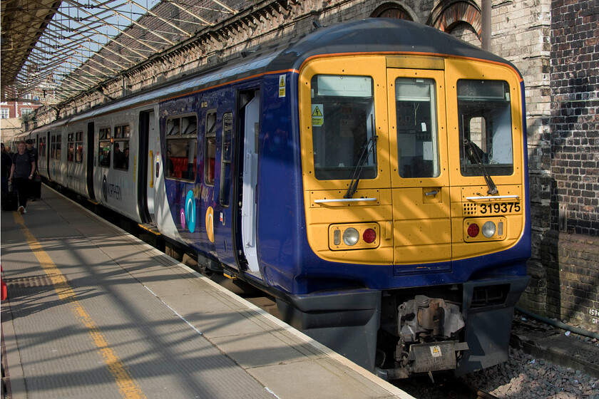 319375, NT 14.17 Crewe-Liverpool Lime Street (2F21, RT), Crewe station 
 Despite being working on the Northern network for a number of years now I still struggle to get my head around seeing a Class 319 away from the Thameslink area that I was so used to ignoring them on for so many years in my local area! Looking very smart standing in the early springtime sunshine 319375 waits at Crewe's platform one to work the 2F21 14.17 service to Liverpool Lime Street via Manchester Airport and Piccadilly.