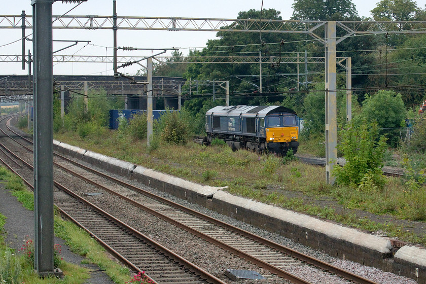 66304, 13.50 DIRFT-Purfleet (4L48, 1L), site of Castlethorpe station 
 Just four minutes after the last up freight 66304 leads the 13.50 4L48 Daventry to Purfleet 'Tesco Express' working. This is another example of a Class 66 of which I have few photographs so I am pleased to have 'got this one in the bag'! 
 Keywords: 66304 13.50 DIRFT-Purfleet 4L48 site of Castlethorpe station Tesco Express DRS Diet Rail Services