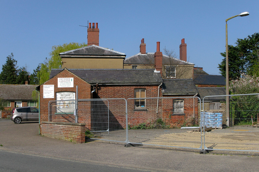 Station building & goods yard, former Wells-next-the Sea station (now bookshop), 
 A side view (from the south) of the former station building at Wells-next-the-sea. This view shows the associated goods office at what was the entrance to the yard. The buildings are remarkably intact considering that they closed fifty years ago. Lines from this Great Eastern outpost on the North Norfolk coast radiated southeastwards towards Fakenenham and thence onwards to Norwich. There was also a line that curved one hundred and eight degrees to then head westwards to Heacham where it joined the King's Lyn to Hunstanton line. Finally, there was also a short single track that led to the town's harbourfront where various fresh produce from the sea was loaded on to small wagons for onward and rapid distribution. 
 Keywords: Station building & goods yard former Wells-next-the Sea station