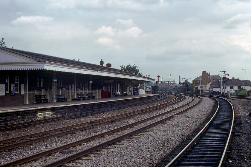 High Wycombe station 
 In this view at High Wycombe station, it wreaks of the GWR both in terms of the station canopy design, the array of lower quadrant signals and the large Type 11 signal box dating from 1905. However, six years before this photograph was taken BR transferred the Marylebone to Birmingham route through the Chilterns from the Western Region to the Midland. The station had offset platforms due to the railways rather confined route through the town hugging to the side of a hill. In this view, the through fast lines are still in place but they were removed in the next two years as part of BR's covert plans to deliberately run down the line in an attempt to make a case for its closure including Marylebone. 
 Keywords: High Wycombe station GWR