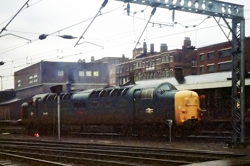 55018, going on-shed, London Kings Cross station 
 A pretty terrible picture that I have rescued from the reject negatives! However, it was probably about 4.30 in the afternoon by now and the capabilities of both the camera and the film were somewhat limited. The image shows 55018 'Ballymoss' moving around on the eastern side of King's Cross but of particular interest is the closed but still dimly lit King's Cross York Road station. This was separate from the main station with its own entrance off York Road and is the point where the suburban trains plunged into a steeply graded and sharply curved tunnel that led to Moorgate station. The station had closed a year earlier with services diverted via the Northern City line. There is no trace of the station today but the entrance to the tunnel is still extant if bricked up. 
 Keywords: 55018 on-shed London Kings Cross station