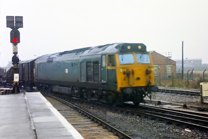 50010, up frieght working, Swindon station 
 This was a bit of a rarity. 50010 arrived from the Bristol direction with a short freight. 50s were designed for fast passenger duties even though they did have all sorts of technology such as slow speed running for freight working, it was rarely used. At this time, 50010 was just coming up to being ten years old. Having been allocated to the London Midland it had moved to the Western in January 1976 where it was allocated to Laira. It stayed a Laira locomotive all of the remainder of its life until it was withdrawn in 1988. 
 Keywords: 50010 freight swindon