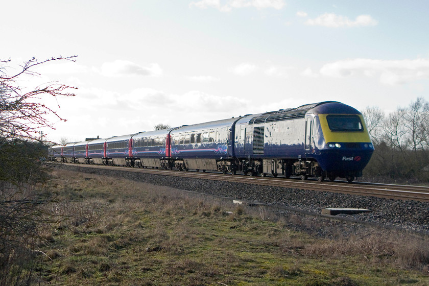 43160, GW 12.28 Swansea-London Paddington (1L62), South Marston foot crossing SU196870 
 Just east of Swindon on the GWML is a foot crossing at South Marston. Pedestrian crossings of this type on the trunk lines on the UK network are getting rare now as Network Rail seeks to close them. There are actually two crossings at this location within a few hundred metres of each other so there will either have to be the expense of building two footbridges or, more than likely, an application will be made to close and divert one of the public footpaths. 43160 'Sir Moir Lockhead OBE' leads the 12.28 Swansea to Paddington past the easternmost of the two crossings located at grid reference SU196870. 
 Keywords: 43160 12.28 Swansea-London Paddington 1L62 South Marston foot crossing SU196870