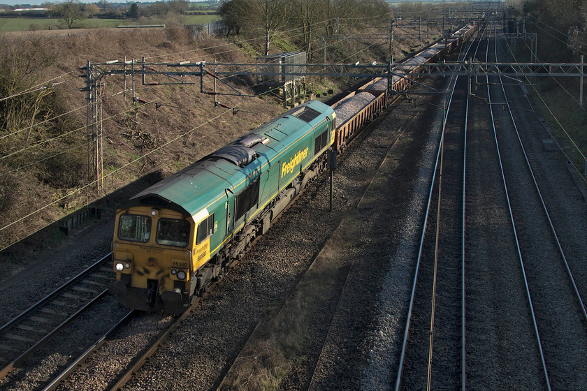 66560, 07.30 Blackhorse Road-Crewe Basford Hall (6Y72, 160L), Victoria bridge 
 An engineering train in the week is a little unusual with most running at weekends in association with various Sunday possessions and work. I was intrigued to see this 6Y72 working on RTT wondering what it was and if it would actually work. After an hour or so I gave up thoughts of seeing it as it had not left. However, during my walk, I noticed that it had departed from London and was making its sedate way up the WCML. Here it is seen passing Victoria bridge over two hours late with 66560 leading as the 07.30 Blackhorse Road (Walthamstow) to Crewe Basford Hall. 
 Keywords: 66560 07.30 Blackhorse Road-Crewe Basford Hall 6Y72 Victoria bridge bllast train engineering working