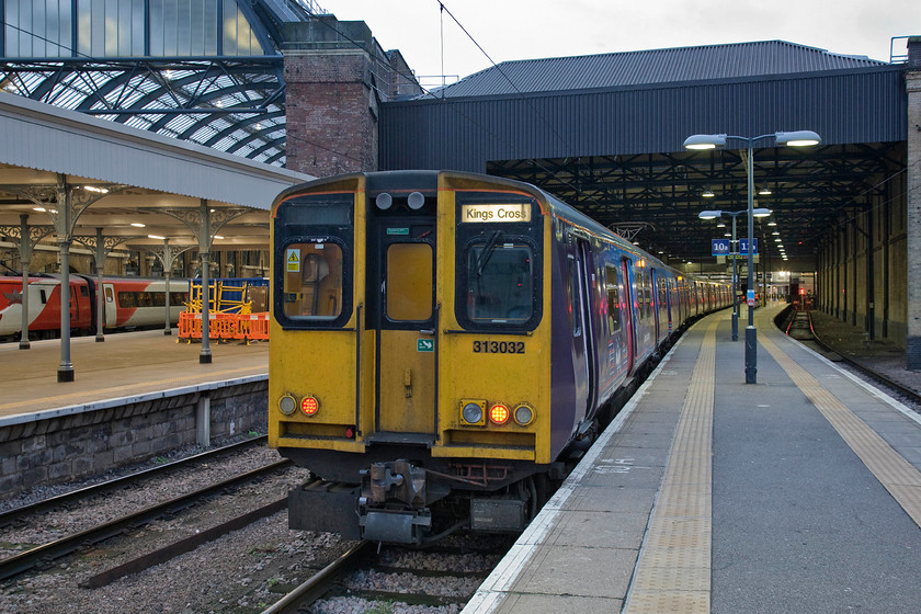 313032, GN 08.11 London KIng's Cross-Welwyn Garden City (2V12), London KIng's Cross station 
 In the chilly half-light at London King's Cross Great Northern's 313032 waits at platform ten with the 08.11 to Welwyn Garden City. I had planned to take this train to Alexandra Palace but the journey was shortened as on approaching Hornsey the charter ECS was seen adjacent to the station. 
 Keywords: 313032 08.11 London KIng's Cross-Welwyn Garden City 2V12 London KIng's Cross station great Northern