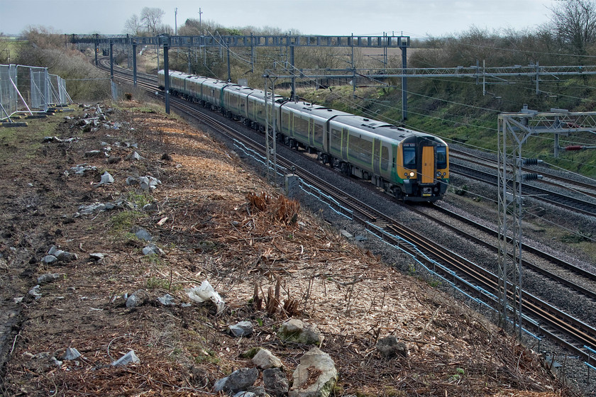 350120, LN 12.31 London Euston-Liverpool Lime Street (Cancelled from Liverpool South Parkway) (1Y81, 20L), Ashton Roade bridge 
 With the weather much brighter than yesterday 350120 passes Ashton Road bridge and the recent embankment clearance forming the 12.31 London Euston to Liverpool Lime Street. Unfortunately, things went awry as the service lost a lot of time later in its journey and it was terminated at Liverpool South Parkway. 
 Keywords: 350120 12.31 London Euston-Liverpool Lime Street 1Y81 Ashton Roade bridge London Northwestern Railway Desiro