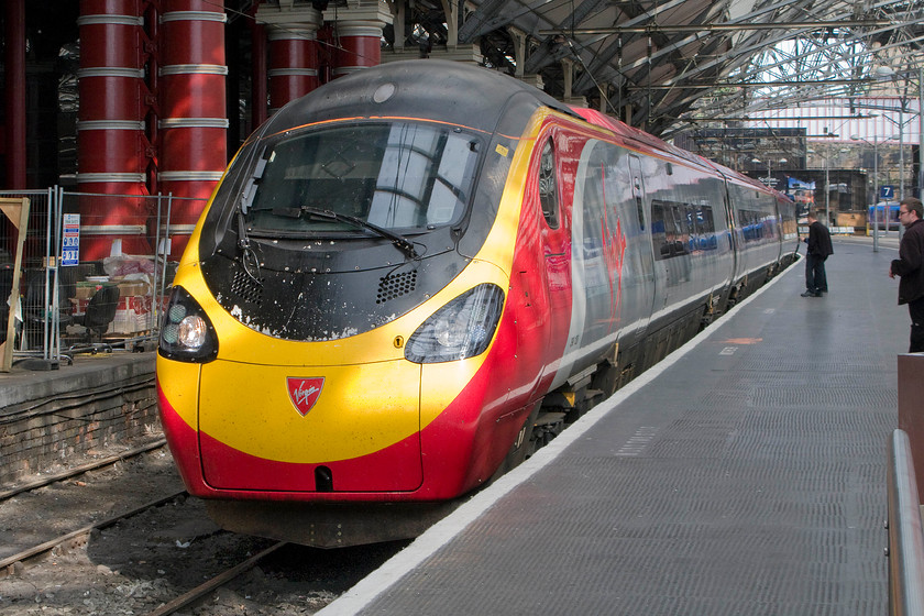 390128, VT 14.07 London Euston-Liverpool Lime Street (1F18), Liverpool Lime Street station 
 With spring sunshine streaming through the roof 390128 'City of Preston' arrives at Liverpool Lime Street station's platform six with the 14.07 from London Euston. Notice the work underway on the closed adjacent platform. I am not sure if this platform is planned to be reinstated having been out of use for many years. 
 Keywords: 390128 14.07 London Euston-Liverpool Lime Street 1F18 Liverpool Lime Street station 390128, VT 14.07 London Euston-Liverpool Lime Street (1F18), Liverpool Lime Street station Virgin Trains Pendolino City of Preston