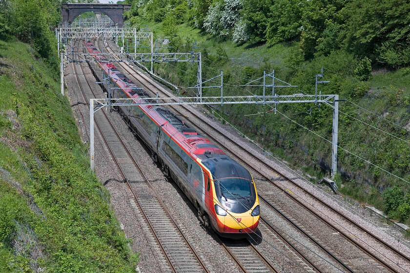 Class 390, VT 11.15 Manchester Piccadilly-London Euston, Hyde Road bridge 
 Now a feature of the WCML for just over ten years and a third of the way through their planned lifespan the Pendolinos have proved themselves to be dependable trains. An unidentified member of the 390/1 sub-set works the 11.15 Manchester Piccadilly to Euston Virgin service. 
 Keywords: Class 390 11.15 Manchester Piccadilly-London Euston Hyde Road bridge Virgin West Coast Pendolino