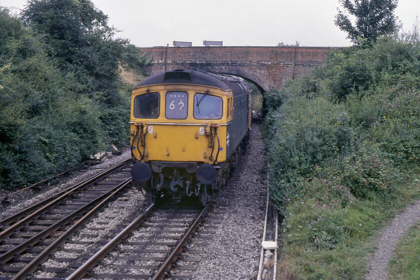 Class 33 & Class 411, 12.10 London Waterloo-Salisbury (1L85), Salisbury Tunnel Junction 
 Unfortunately, passing so close to Salisbury Tunnel signal box made the identification of the locomotive and unit impossible. In addition, the usual fallback and 'fact checking' site The RailGenArchive did not have a listing for this working. All I can do is narrow the Crompton down to one on nineteen 33/1s equipped with push/pull jumper equipment. Equally, all that I have in my notes is that the unit being trailed was a Class 411 4CEP unit. The service was easier to identify as the 12.10 London Waterloo to Salisbury 'semi-fast' service that carried the 1L85 headcode (confirmation anybody?). The Crompton sports it correct Southern Region identifier of 62 referring to a 'Waterloo, Woking or Basingstoke and Salisbury or Exeter St Davids semi-fast'*

* According to the Southern Railway e-mail Group's website. 
 Keywords: Class 33 411, 12.10 London Waterloo-Salisbury 1L85 Salisbury Tunnel Junction Crompton