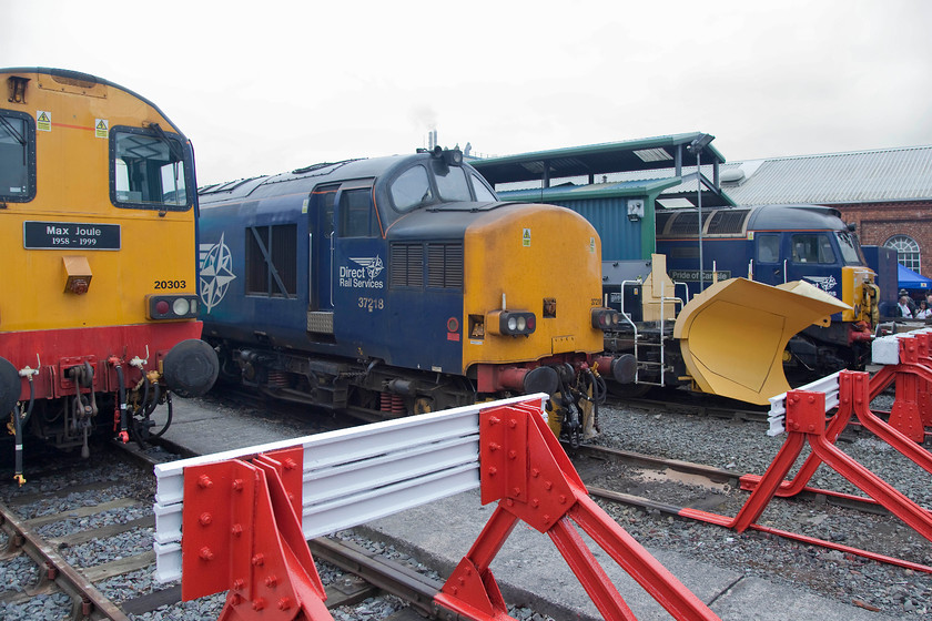 20303, 37218 & 47712, on-display, DRS Open Day, Gresty Bridge 
 An impressive line up of vintage locomotives at Gresty Bridge all owned and operated by DRS. 20303 'Max Joule 1958-1995', 37218 and 47712 'Pride of Cumbria' are seen proudly displaying their updated DRS Compass livery. Despite the thousands of visitors, with a little patience and thought, a decent picture or two can be taken avoiding it being blighted by fellow spotters!