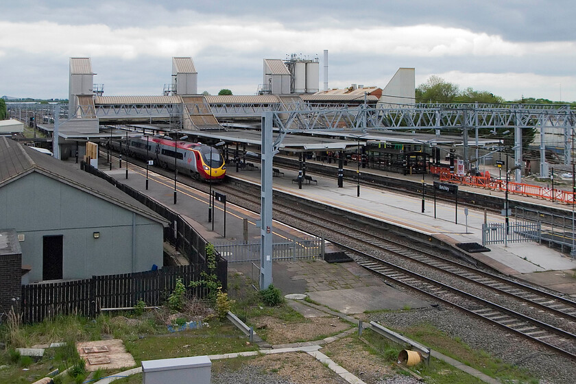 Class 390, VT 08.40 Glasgow Central-London Euston, Bletchley station from Bletchley PSB 
 An unidentified Class 390 Pendolino passes through Bletchley station working the 08.40 Glasgow to Euston service. The photograph is taken from the open window of the closed power box that had opened its doors just one more time for visitors. 
 Keywords: Class 390 08.40 Glasgow Central-London Euston, Bletchley station Bletchley PSB Virgin West Coast pendolino