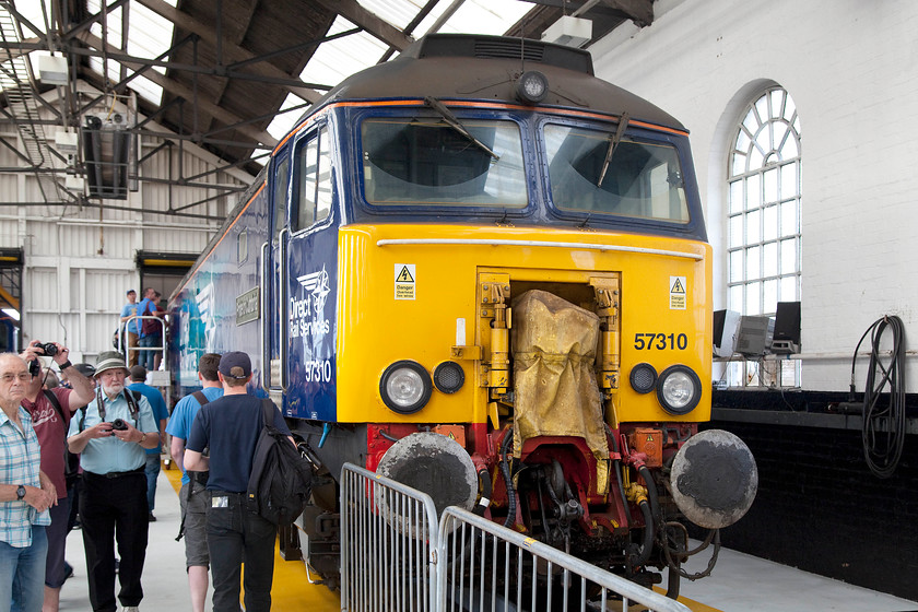 57310, on-display, DRS Gresty Bridge 
 57310 is a former Virgin Thunderbird that carried the named 'Kyrano'. It still carries it Dellner retractable couplings as DRS have now taken over the contract to provide Thunderbird support for the WCML. Now in DRS livery, 57310 now is named 'Pride of Cumbria' reflecting DRS's northern heritage. 
 Keywords: 57310 DRS Gresty Bridge