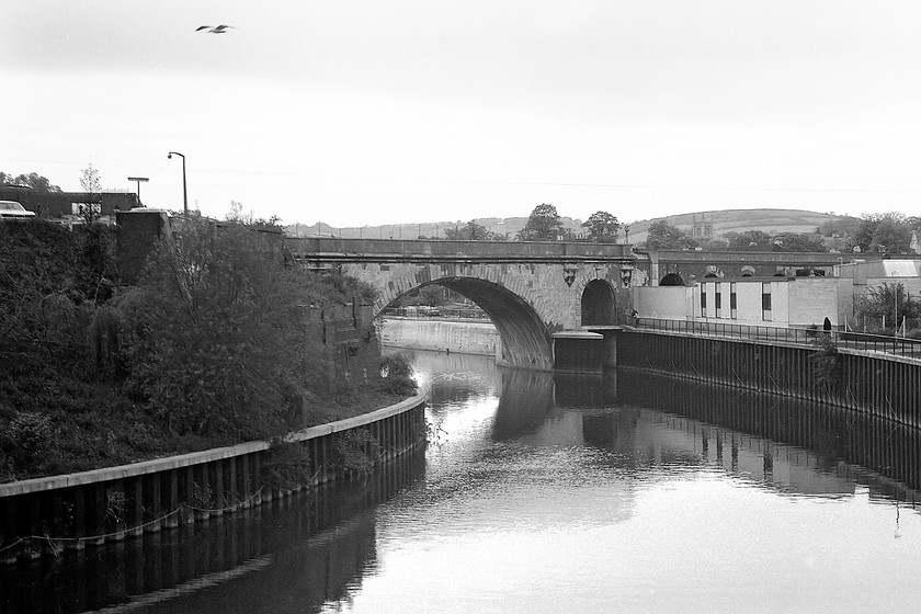 St. James` bridge & Dolemeads viaduct 
 In common with much of the architecture in and around Bath, including the station, the St. James' bridge is constructed of Bath stone that is an oolitic limestone. It also has some brick components but is an attractive structure none-the-less. It is seen crossing the River Avon just to the east of the station. Beyond the arch is the Dolemeads viaduct that carries the GWML above the houses of Bath before crossing the A36 road and plunging into the tunnels of the famous Sydney Gardens. 
 Keywords: St. James` bridge Dolemeads viaduct