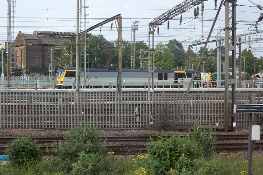 92044, 87002 & 09007, stabled, Willesden TMD 
 As we pass Willesden depot 92044 'Couperin', 87002 'Royal Sovereign' and 09007 sit stabled in the afternoon sunshine. Not a great shot but one that shows several eras of locomotive in one place. 
 Keywords: 92044 87002 09007 Willesden TMD