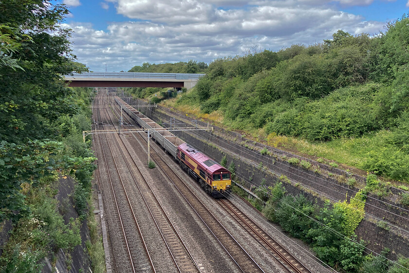 66040, 11.59 Burton-ot-Wetmoor-Acton TC (6V06, 4L), Roade cutting 
 The extremely wide angle of the lens on my elderly iPhone and the lack of a proper zoom means that this is a much broader view of Roade cutting than I usually capture with my camera (in for repair at the moment). The lighting is good and I actually like this image of 66040 leading the 11.59 Burton-ot-Wetmoor to Acton empty stone train running as 6V06. This is not a regular working so I was pleased to witness its passage whilst out for my walk. 
 Keywords: 66040 11.59 Burton-ot-Wetmoor-Acton TC 6V06 Roade cutting EWS