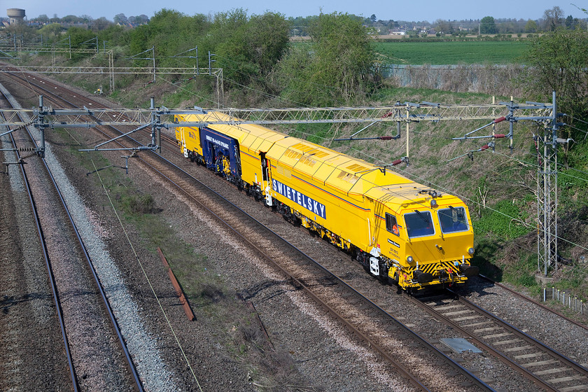 DR75012, 10.00 Bletchley-Bletchley (via Wigston North & Nuneaton) (13E), Victoria bridge 
 I had been tracking this mysterious move emanating from and returning to engineering works on the up and down fast lines south of Milton Keynes half expecting it to be a track machine. I was right; DR75012 passes Victoria bridge with the 10.00 Bletchley to Bletchley return that went via Nuneaton, Leicester and Wigston North Junction where I presume it reversed on the triangle. DR75012 is a Plasser and Theurer Unimat Dynamic Tamper that is owned and operated by Swietelsky Babcock Rail (SBRail) acting as a contractor for Network Rail. 
 Keywords: DR75012 10.00 Bletchley-Bletchley Wigston North & Nuneaton13E Victoria bridge