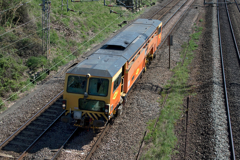 DR73912, 10.57 Stowmarket-Rugby DED (4L), Victoria bridge 
 Instantly recognisable in its Colas livery rail tamper DR73912 'Lynx' passes Victoria bridge just south of Roade. It was making a fairly long journey as the 10.57 Stowmarket to Rugby in preparation for work to take place over the coming weekend on the WCML. 
 Keywords: DR73912, 10.57 Stowmarket-Rugby DED Victoria bridge