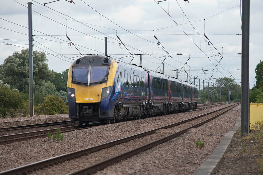 180110, HT 08.23 Hull-London Kings Cross (1A92, 2L), Offord DArcy TL213655 
 The foot crossing, from which the picture is taken, is little used and took some finding and is located just south of Offord DArcy. Indeed, the brambles and weeds needed clearing to get to it! However, it is maintained and has crossing lights. It affords good views of the line in both directions but I suspect it's time is limited due to NR's policy of closing all foot crossings on the network. 180110 forms the 08.23 Hull to King's Cross. 
 Keywords: 180110 1A92 Offord DArcy TL213655