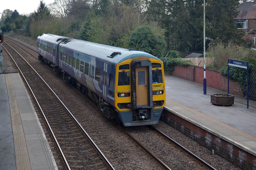 1589087, NT 11.24 Sheffileld-Bridlington (1W44, 1E), Cottingham station 
 Cottingham is a large village to the north west of Hull that over the years has grown, as has Hull itself, to the point where it has been subsumed to become a suburb of the city. However, it retains its own character and has a well used railway station with a regular service. Here, 158087 arrives with the 11.24 Sheffield to Bridlington service. 
 Keywords: 1589087 11.24 Sheffileld-Bridlington 1W44 Cottingham station