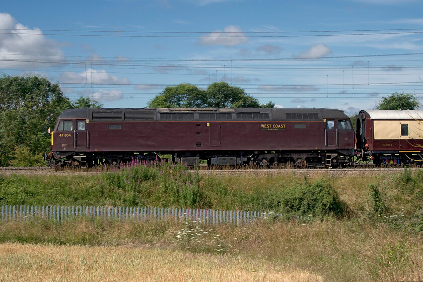 47804, 09.02 London Euston-Milton Keynes Central (1Z60, 4L), between Roade & Ashton 
 47804 brings up the rear of the 1Z60 Euston to Milton Keynes GP special via a reversal at Northampton past the fields between Roade and Ashton. Within an hour the train would return south with 47804 leading to drop off its passengers at Milton Keynes for onward travel (via coaches) to Silverstone. The racegoers would enjoy a scintillating and action-packed British Grand Prix that would see Carlos Sainz win his first F1 race with Lewis Hamilton coming in third. 
 Keywords: 47804 09.02 London Euston-Milton Keynes Central 1Z60 between Roade & Ashton WCR West Coast Railways