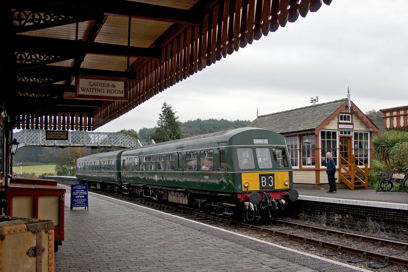 E51188 & E56062, 10.40 Sheringham-Holt, Weybourne station 
 The ultimate in lazy photography! Taken sitting on a platform bench at Weybourne station whilst enjoying a coffee the 10.40 Sheringham to Holt NNR service arrives at the station. There were a reassuringly sufficient number of passengers aboard the Class 101 DMU composed of E51188 and E56062 despite it being such a dull Monday morning and not yet a holiday week. 
 Keywords: E51188 E56062 10.40 Sheringham-Holt Weybourne station Class 101 DMU