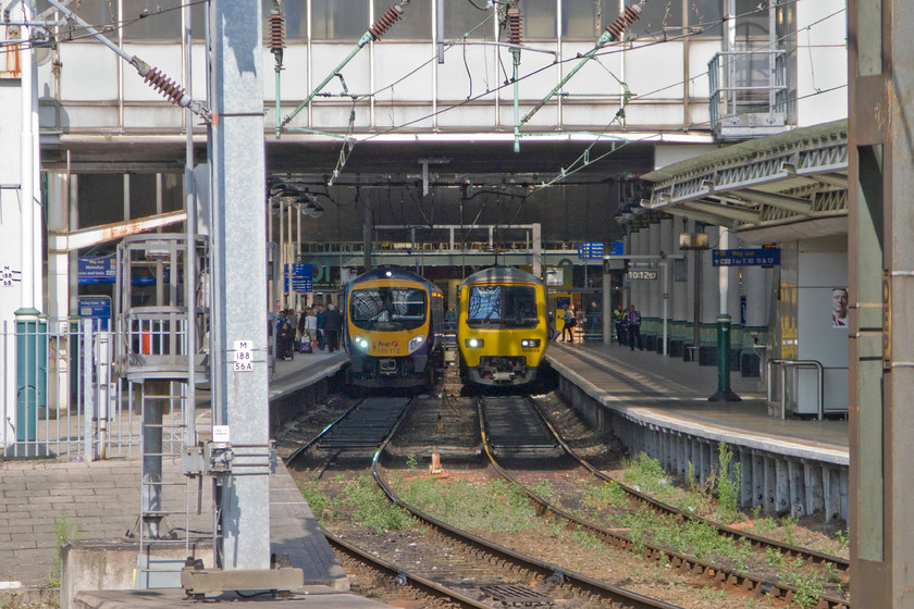 185112, TP 07.26 Cleethorpes-Manchester Airport (1B69) & 323233, NT 10.14 Manchester Piccadilly-Manchester Airport (2A75), Manchester Piccadilly station 
 Due to missing our connecting train because our Crosscountry service arrived late into Manchester Piccadilly, we had a little time on our hands. Turning my camera round looking back into the main station sees two trains standing at platforms nine and ten. To the right is 323233 that will soon leave with the 10.14 to Manchester Airport. To the left 185112 has just arrived with the 07.26 from Cleethorpes and will soon partially retrace its steps also to Manchester Airport. 
 Keywords: 185112 07.26 Cleethorpes-Manchester Airport 1B69 323233 10.14 Manchester Piccadilly-Manchester Airport 2A75 Manchester Piccadilly station Trans Pennine Express Northern Trains