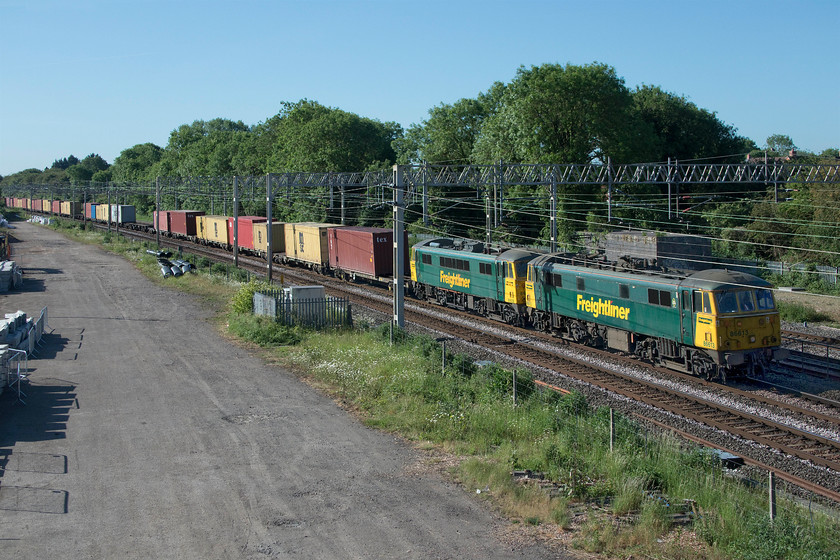 86628 & 86613, 02.50 Felixstowe North-Garston (4M45, 35E), site of Roade station 
 Twenty minutes earlier I photographed the southbound 4L89, see...... https://www.theimagefile.com/?Action=MF&sa=editfile&id=29069578004 Here is the northbound 4M45 02.50 Felixstowe North to Garston hauled by another pair of vintage AL6s 86628 and 86613. I am taking every opportunity to photograph the Class 86s in what will be their last summer of operation due to Freightliner acquiring a number of ex Greater Anglia Class 90s that are being prepared for operations on their services. Due to COVID delays, this process should be more advanced than at present so the AL6s really are on borrowed time. 
 Keywords: 86628 86613 02.50 Felixstowe North-Garston 4M45 site of Roade station Freightliner AL6