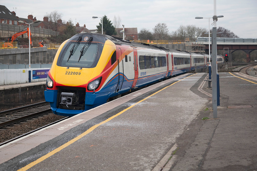 222009, EM 12.41 Corby-London St. Pancras (1P17, 3L), Wellingborough station 
 The 12.41 Corby to St. Pancras arrives at Wellingborough station formed of Meridian 222009. Whilst there is no evidence of the electrification programme at the north end of the station there are huge changes going on in the background. A new bridge and access road is being constructed to link the huge eastern expansion of Wellingborough with the rest of the town. Unfortunately, this bridge has completely ruined the panoramic view of the station from Mill Road bridge beyond the new structure. 
 Keywords: 222009 12.41 Corby-London St. Pancras 1P17 Wellingborough station