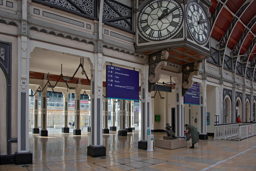 Eastbourne Terrace entrance, platform 1, London Paddington station 
 One of the two new entrances that have been punched through the wall of Paddington station adjacent to platform one. This one connects directly with a covered walkway to the entrance to the yet-to-open Crossrail entrance. The entrance is directly below the superb and ornate three-face clock that is a significant feature of platform one. Also in this view is the ever-popular statue of Paddington station's eponymous bear having yet another photograph taken by an admirer. 
 Keywords: Eastbourne Terrace entrance platform 1 London Paddington station