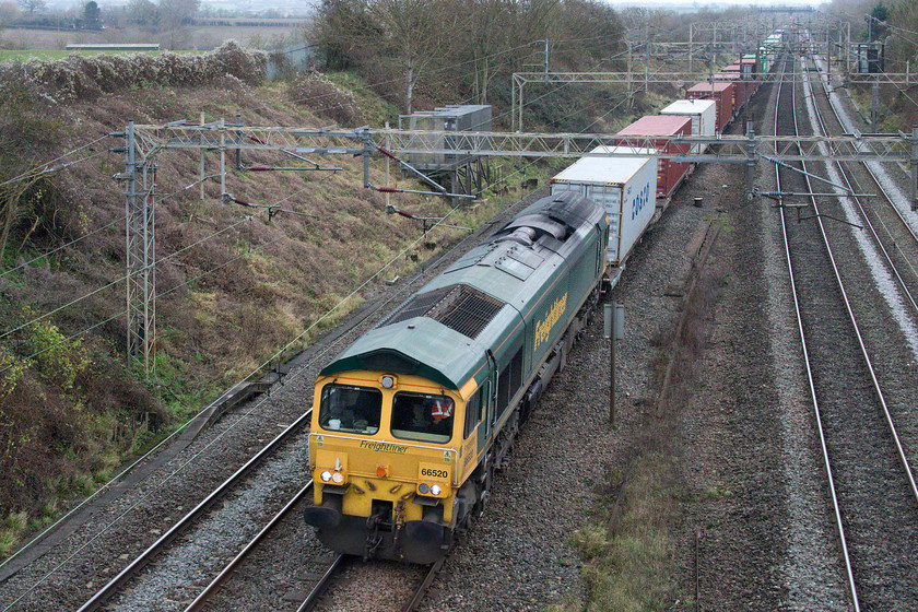 66520, 09.12 Felixstowe North-Trafford Park (4M63, RT), Victoria bridge 
 I seem to make a habit of photographing 66520 in awful weather! On a very grey and dull December afternoon, it is seen passing Victoria bridge leading the 4M63 09.12 Felixstowe North to Trafford Park Freightliner. Almost exactly five years previously, I captured it in equally awful weather at Bramley station, see.... https://www.ontheupfast.com/p/21936chg/29360076004/x66520-13-28-eastleigh-yard-hinksey 
 Keywords: 66520 09.12 Felixstowe North-Trafford Park 4M63 Victoria bridge Freightliner