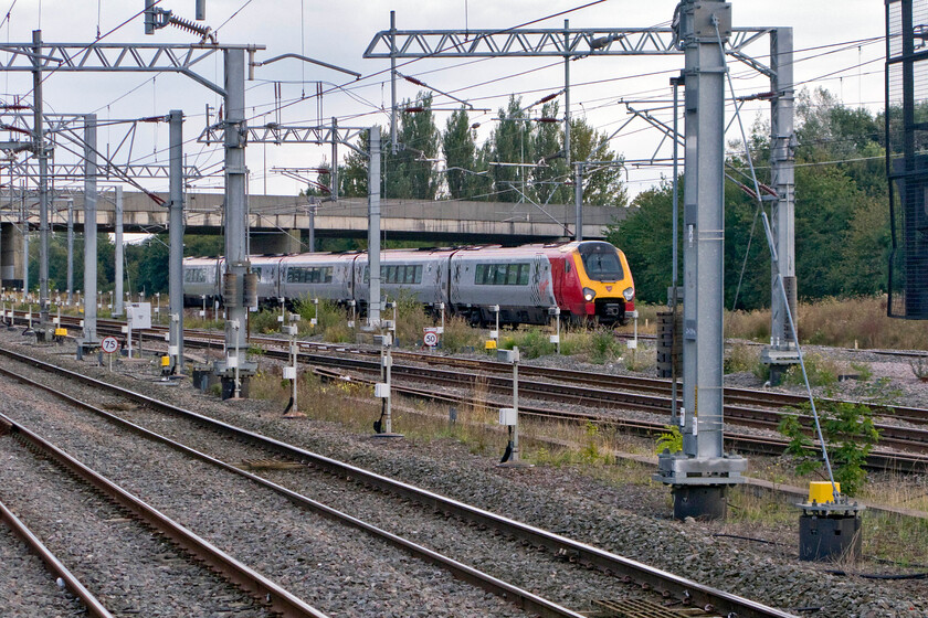 221118, VT 16.10 London Euston-Bangor (1D90), Milton Keynes Central station 
 The 1D90 16.10 Euston to Bangor Virgin service slows for its stop at Milton Keynes. In the earlier years of Virgin's operation of this route they ran much longer Pendolinos on services such as this (and those to Holyhead) hauled by Class 57s to and from Crewe 
 Keywords: 221118 16.10 London Euston-Bangor 1D90 Milton Keynes Central station Virgin Trains Voyager