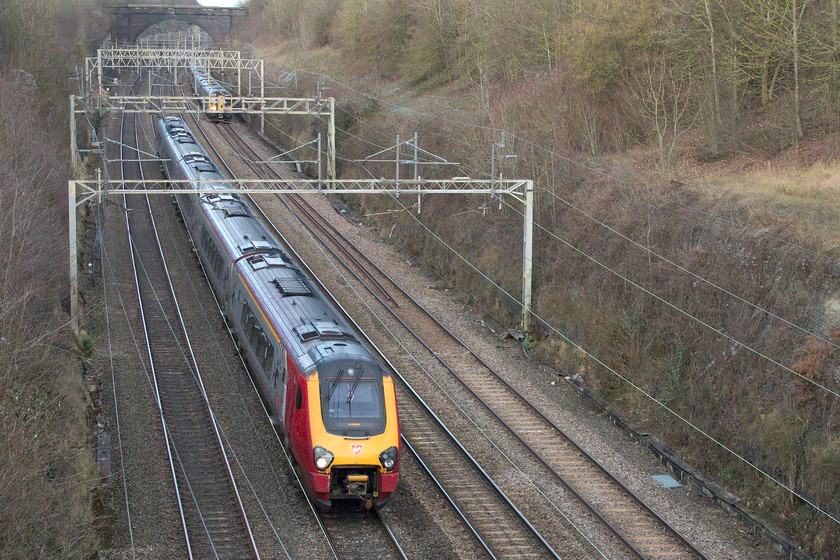 Class 221, VT 08.55 Holyhead-London Euston (1A25, 2L), Hyde Road bridge 
 A class 221 heads south under Hyde Road bridge in the village of Roade forming the 08.55 Holyhead to London Euston. The 10.35 Birmingham New Street to Euston can be seen on the up slow line. 
 Keywords: Class 222 08.55 Holyhead-London Euston 1A25 Hyde Road bridge