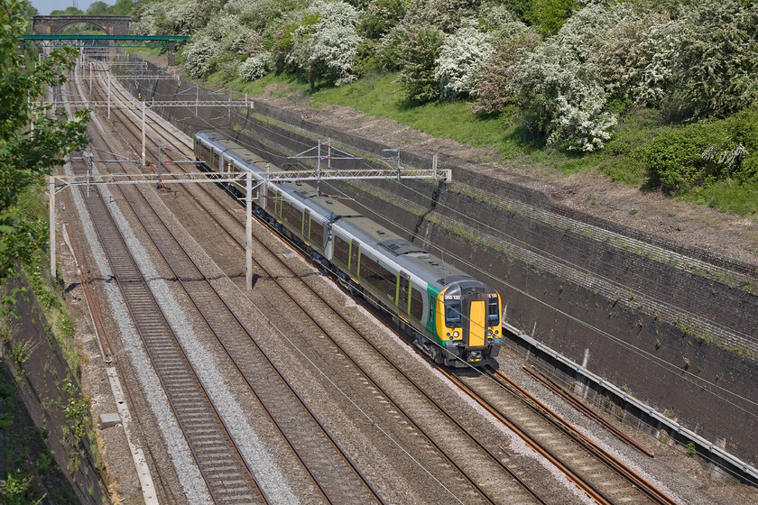 350130, LM 12.40 Northampton-Milton Keynes ECS (5K20), Roade cutting 
 350130 passes through a sunny Roade cutting on a superb spring day working the 12.40 Northampton to Milton Keynes Central empty stock working. It was a really pleasantly warm Sunday afternoon to stand and watch the trains pass, very different conditions to so many that we all have endured over the years in the pursuit of our hobby! 
 Keywords: 350130 12.40 Northampton-Milton Keynes ECS 5K20 Roade cutting London Midland Desiro