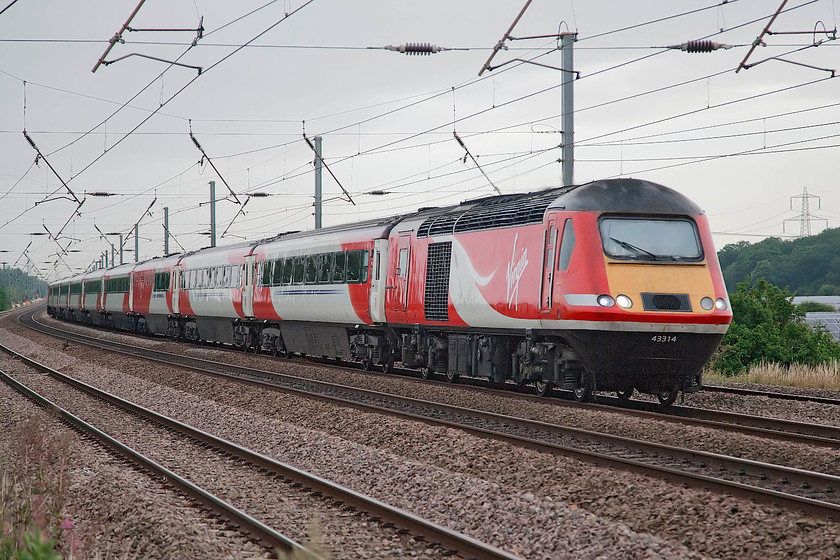 43314, GR 07.30 Lincoln-London Kings Cross (1B81, 4L), Sandy TL176510 
 The 07.30 Lincoln to London King's Cross HST is lead by power car 43314. It is seen passing the delightfully named New Zealand bridge just north of Sandy. 43314 was delivered as an Eastern Region power car in 1979 as part of set 254030 and there it has been since. In nearly forty years of use on the ECML I wonder if there are any figures as the distance it has travelled in its working life? 
 Keywords: 43314 1B81 Sandy TL176510