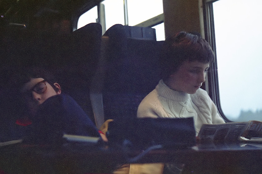 Jo & Guy, return journey 
 After an exhausting day fighting the crowds at Crewe Works Open Day, my friend Jo sleeps whilst Guy avidly catches up with the latest news in Railway Magazine whilst on the journey home in our comfy Mk.2 coach. No cramped claustrophobic Voyager 'airline style' seating to be had here!