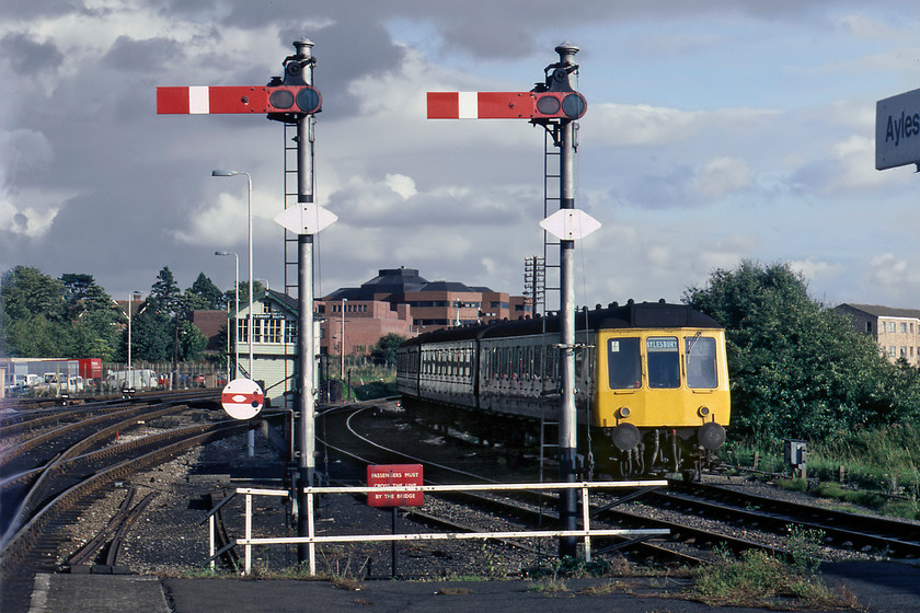 Class 115 DMU, stabled, Aylesbury station 
 After a largely dull day by the time we were about to head for home the sun came out! Graham and I reached Aylesbury station to find it eerily quiet on a Saturday afternoon. Looking south-east from the platform end reveals some lovely mechanical signalling controlled by the 1908 Great Central box. The thirty-eight miles route south of here to London was jointly operated by the Great Central and Metropolitan railways giving rise to an interesting and eclectic mix of infrastructure. 
 Keywords: Class 115 DMU Aylesbury station