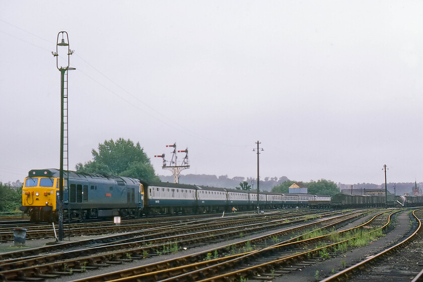 50017, 07.37 Exeter St. David's-London Waterloo (1O06), Salisbury East Yard 
 The dull weather has done nothing for the composition of this photograph taken deep in Salisbury's East Yard. 50017 'Royal Oak' is seen passing through the yard following its departure from Salisbury station leading the 1O06 07.37 Exeter St. David's to London Waterloo service. The former signal box, seen behind the rear of the train, was replaced by two electro-pneumatic boxes (East and West) in 1902 when the L&NWR modernised signalling in and around the station. 
 Keywords: 50017 Royal Oak 07.37 Exeter St. David's-London Waterloo 1O06 Salisbury East Yard