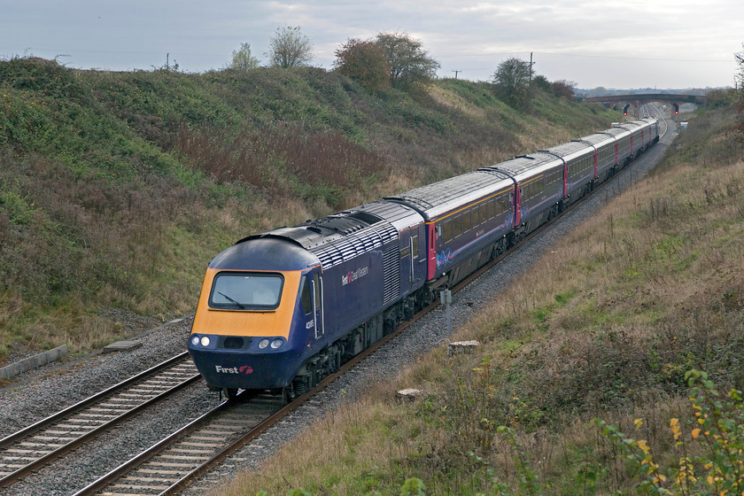 43165 & 43137, GW 12.55-Cardiff Central-London Paddington (1L60), Bourton SU234875 
 One of my favourite spots on the GWML is an occupation bridge that carries a small track and a footpath over the line near the village of Bourton just east of Swindon. However, this spot will soon be spoilt somewhat by the electrification masts the footings of which can be seen next to the leading power car. 43165 'Prince Michael of Kent' and 43137 power the 12.55 1L60 Cardiff Central to Paddington past this lovely spot; I wonder if I will return again? 
 Keywords: 43165 43137 12.55-Cardiff Central-London Paddington 1L60 Bourton SU234875