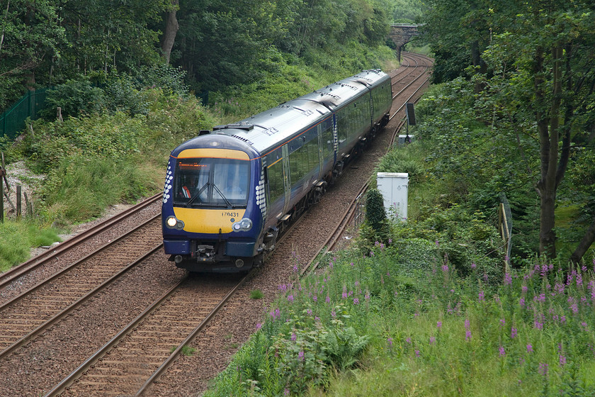 170431, SR 11.38 Glenrothes with Thornton-Edinburgh Waverley (2G10, 3L), Dunfermline Park, Public Road bridge 
 With the sun having just gone behind a troublesome cloud some thirty seconds before 170431 arrived a shade photograph will have to suffice as it passes Dumfirmline park. 170431 is forming the 11.38 Glenrothes with Thornton to Edinburgh Waverley train. 
 Keywords: 170431 11.38 Glenrothes with Thornton-Edinburgh Wsverley 2G10 Dunfermline Park, Public Road bridge